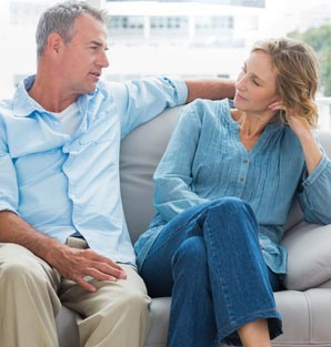 Does Marriage Counseling Work? - Couple on the couch talking during counseling